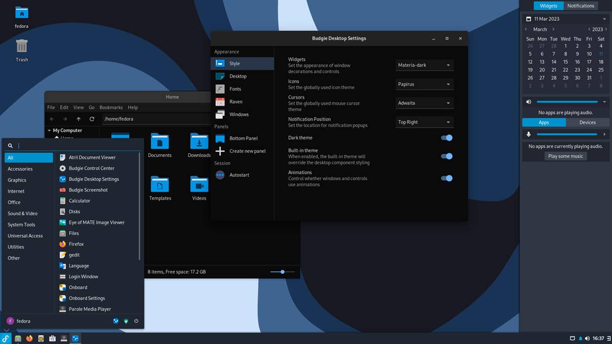 Captura de pantalla del entorno de escritorio Budgie mostrando varias ventanas, incluyendo el menú de aplicaciones, la configuración del escritorio y el explorador de archivos.